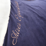 Shires Deluxe Fleece Stable Sheet (No Fill) in Navy - Closeup of Shires logo